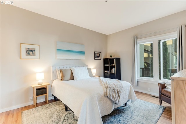 724 NW Westover Cir, Portland, OR 97210 - bedroom with wood finished floors and baseboards