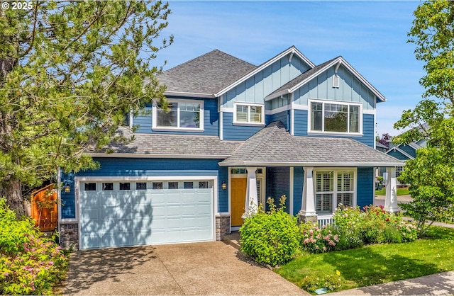 3823 NW Tustin Ranch Dr, Portland, OR 97229 - craftsman-style house with board and batten siding, driveway, covered porch, an attached garage, and a shingled roof