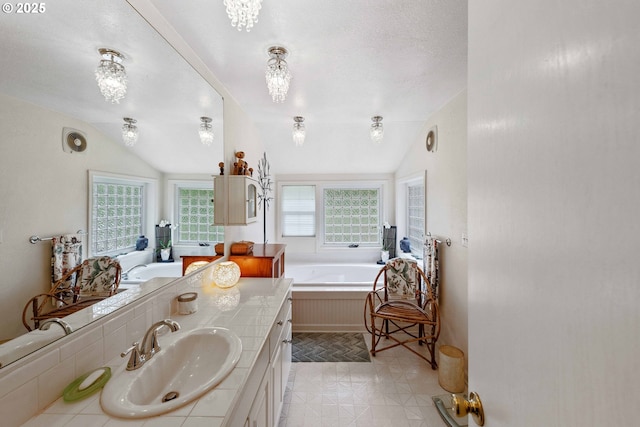 93648 W Mill Ln, Coos Bay, OR 97420 - bathroom featuring lofted ceiling, a bath, healthy amount of natural light, and vanity