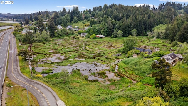 93648 W Mill Ln, Coos Bay, OR 97420 - aerial overview of property's location featuring a heavily wooded area and a major roadway