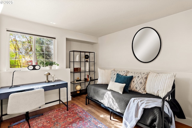 home office with wood finished floors