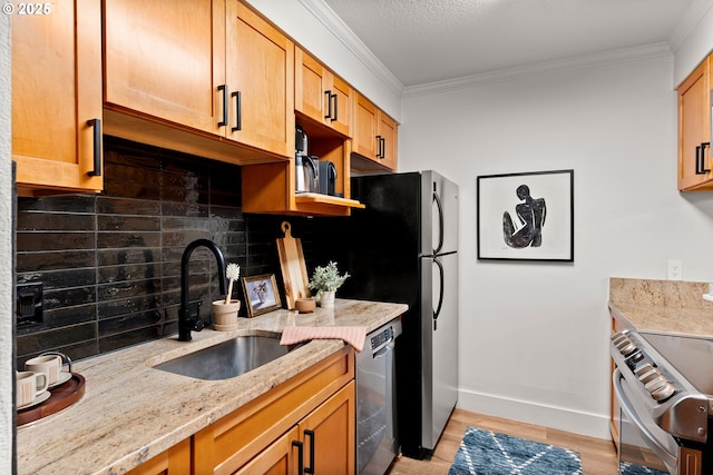 kitchen featuring crown molding, light stone countertops, dishwasher, stainless steel range with electric cooktop, and a sink