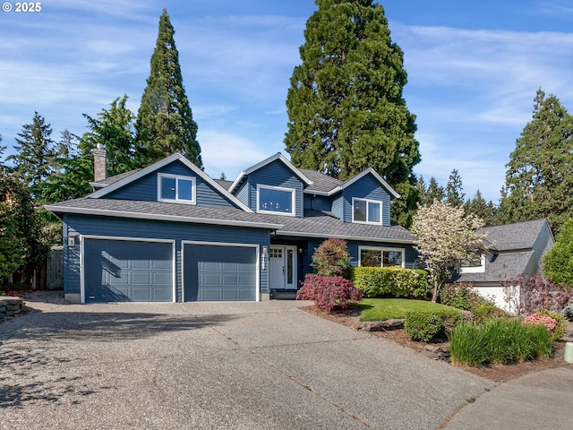 craftsman house with roof with shingles, a garage, and driveway