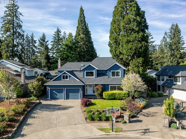 craftsman house featuring roof with shingles, concrete driveway, and a garage