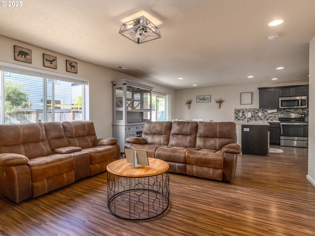 13012 NE 115th St, Vancouver, WA 98682 - living area featuring dark wood-style floors, recessed lighting, and a textured ceiling