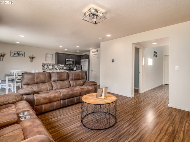 13012 NE 115th St, Vancouver, WA 98682 - living area with dark wood-style floors, recessed lighting, and baseboards