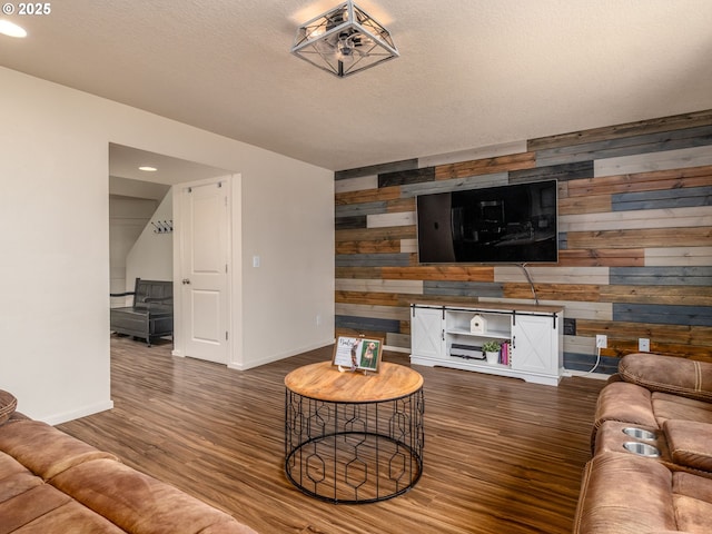 13012 NE 115th St, Vancouver, WA 98682 - living area featuring wood walls, wood finished floors, baseboards, an accent wall, and recessed lighting