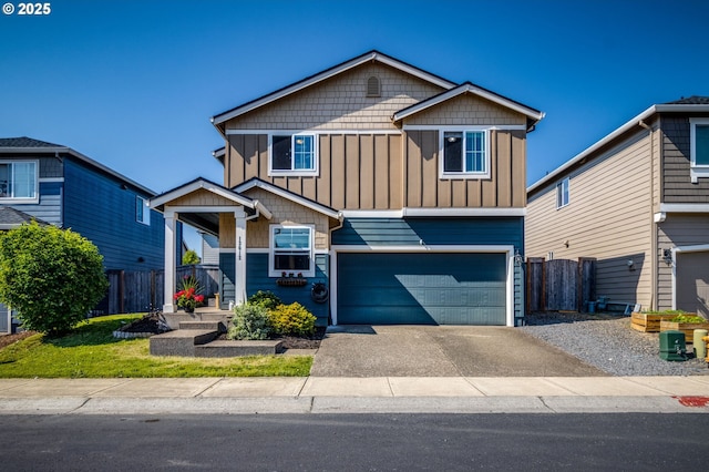 13012 NE 115th St, Vancouver, WA 98682 - view of front of home with board and batten siding, a garage, and driveway