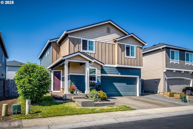 13012 NE 115th St, Vancouver, WA 98682 - view of front of property featuring board and batten siding, an attached garage, and asphalt driveway