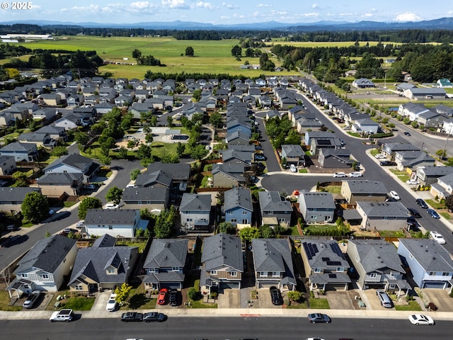 13012 NE 115th St, Vancouver, WA 98682 - aerial view of property and surrounding area featuring nearby suburban area and a mountainous background