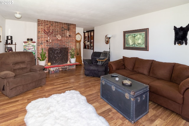 living room featuring hardwood / wood-style flooring and a fireplace