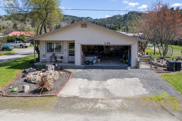 view of front of house with a garage and a mountain view