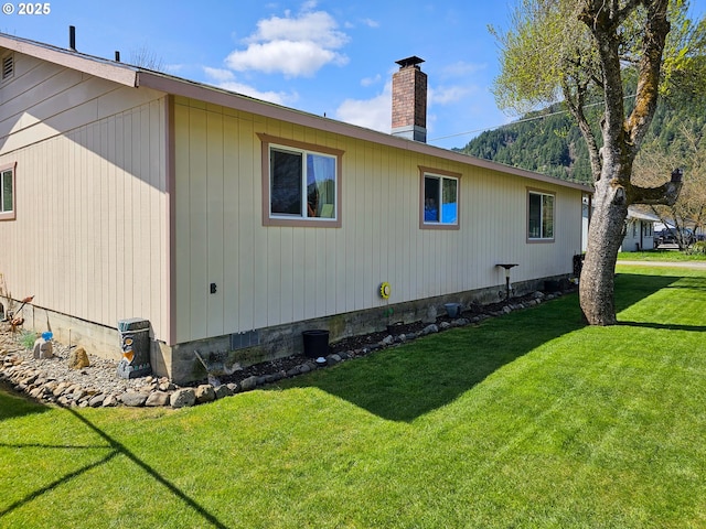 view of property exterior featuring a yard