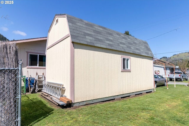 view of outdoor structure featuring a yard