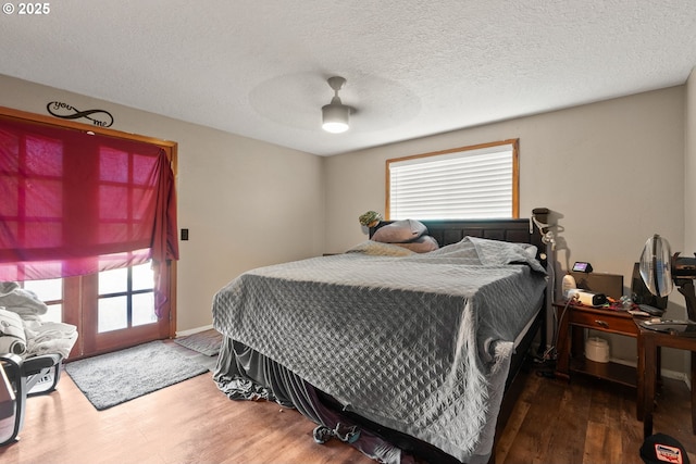 2012 SE Evans Ave, Troutdale, OR 97060 - bedroom with wood finished floors, ceiling fan, and a textured ceiling
