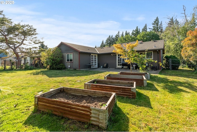 2012 SE Evans Ave, Troutdale, OR 97060 - rear view of property with a vegetable garden and a patio area