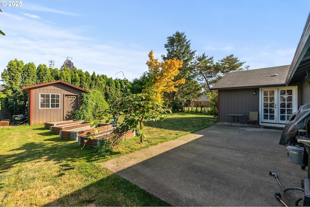 2012 SE Evans Ave, Troutdale, OR 97060 - view of yard featuring french doors, a garden, a patio, and a storage shed
