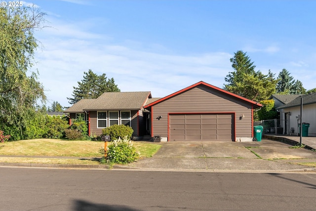 2012 SE Evans Ave, Troutdale, OR 97060 - ranch-style home featuring an attached garage, concrete driveway, and a front lawn