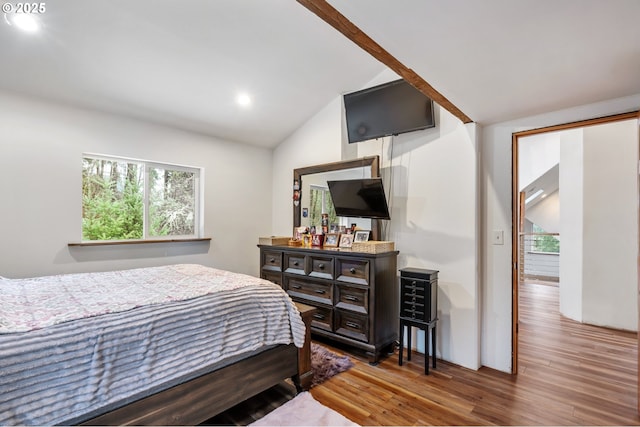 bedroom featuring multiple windows, vaulted ceiling, recessed lighting, and wood finished floors