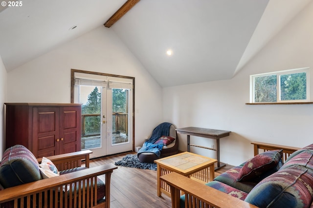 living room featuring vaulted ceiling with beams, wood finished floors, a wealth of natural light, and french doors