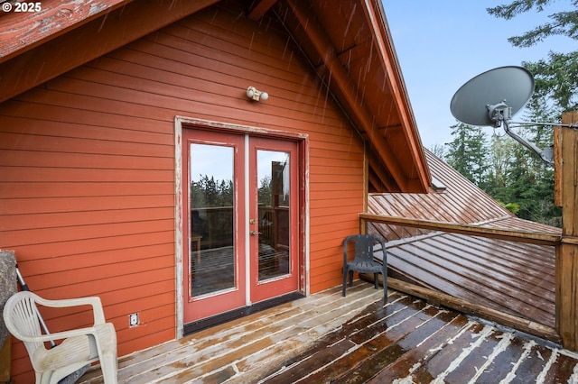 view of home's exterior with french doors and a wooden deck