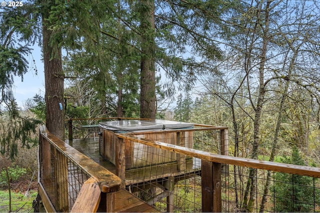 deck with a hot tub