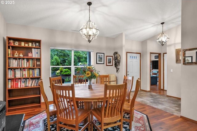 5030 Heceta Park Way, Florence, OR 97439 - dining room featuring a chandelier and wood finished floors