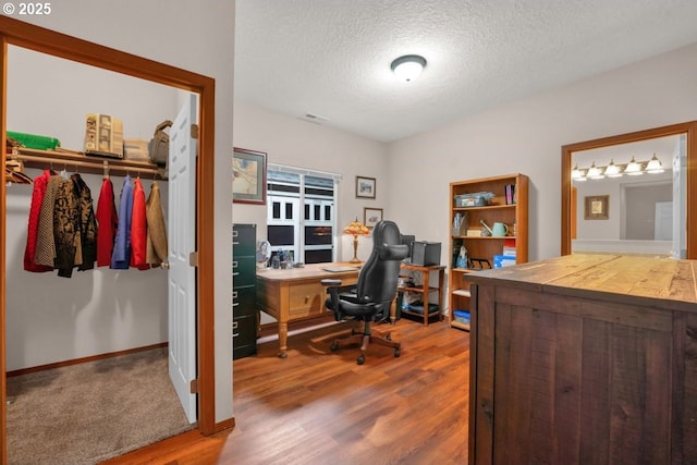 5030 Heceta Park Way, Florence, OR 97439 - office space featuring a textured ceiling and wood finished floors