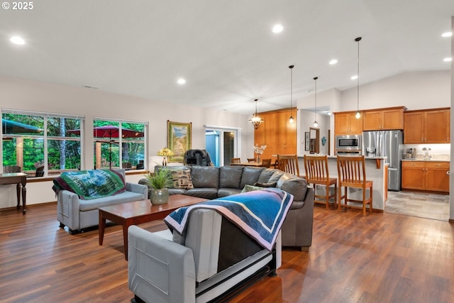 5030 Heceta Park Way, Florence, OR 97439 - living area featuring dark wood-style flooring, recessed lighting, and vaulted ceiling