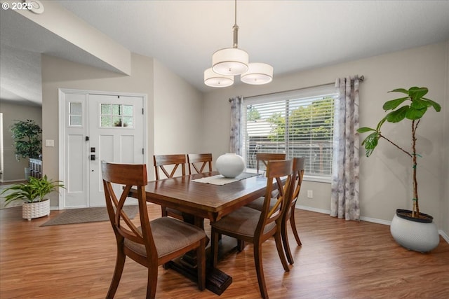 1613 SE Solomon Loop, Vancouver, WA 98683 - dining space with light wood finished floors, plenty of natural light, a chandelier, and vaulted ceiling