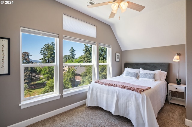 bedroom featuring ceiling fan, lofted ceiling, and carpet floors