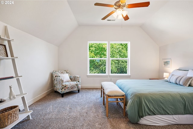 carpeted bedroom with ceiling fan and vaulted ceiling