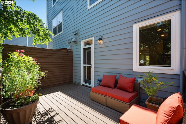 wooden deck with an outdoor hangout area