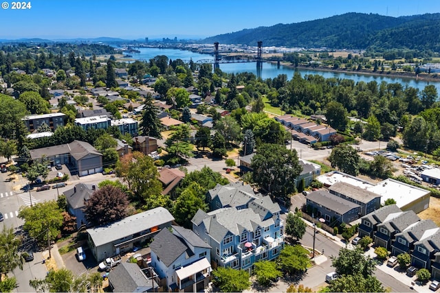 bird's eye view with a water and mountain view