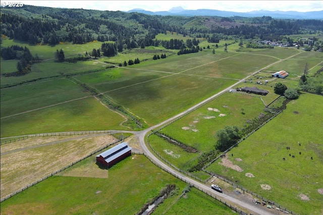 91146 Pioneer Farm Rd, Warrenton, OR 97146 - aerial view of property and surrounding area featuring rural landscape, a mountainous background, and a pastoral area