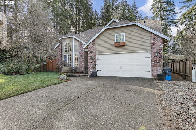 traditional home with a front yard, fence, brick siding, and driveway