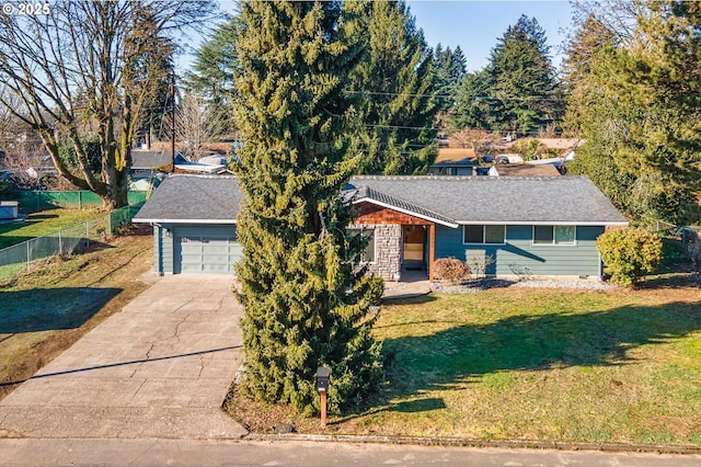 ranch-style home featuring a garage and a front yard