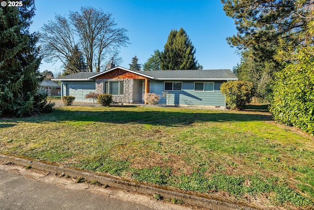 ranch-style house featuring a garage and a front yard