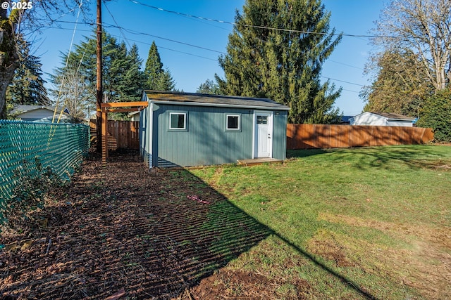 view of outbuilding with a yard