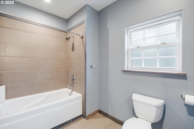 full bath featuring baseboards, shower / bathing tub combination, toilet, and tile patterned floors