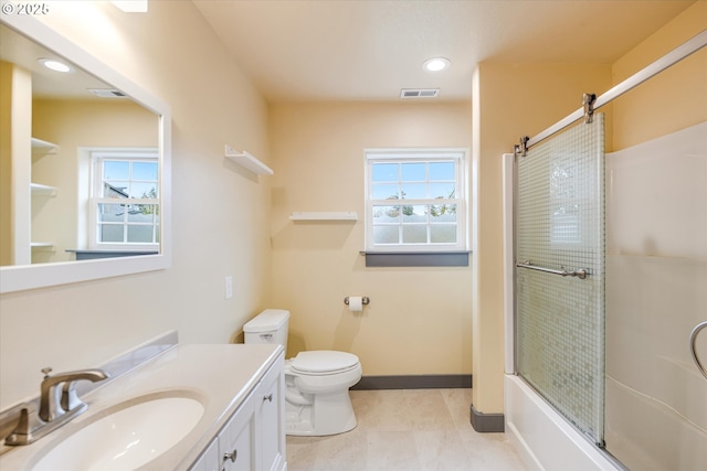 bathroom with a healthy amount of sunlight, visible vents, and vanity