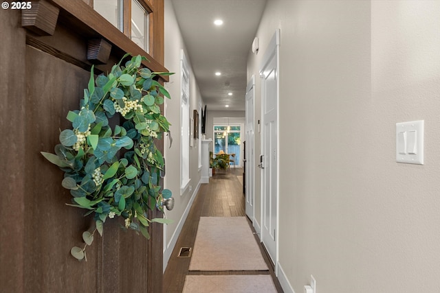 corridor featuring wood-type flooring