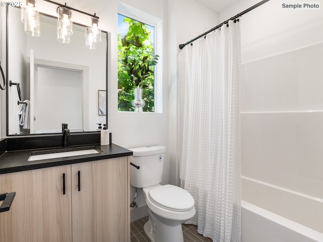 207 NE Going St Unit 3, Portland, OR 97211 - bathroom featuring vanity, shower / tub combo with curtain, and tile patterned floors