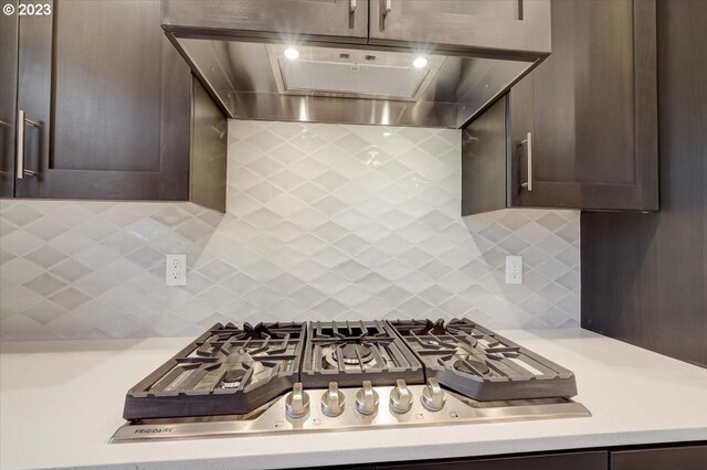 1636 N Millican Crfeek St, Lafayette, OR 97127 - kitchen with wall chimney range hood, stainless steel gas stovetop, dark brown cabinetry, and light countertops