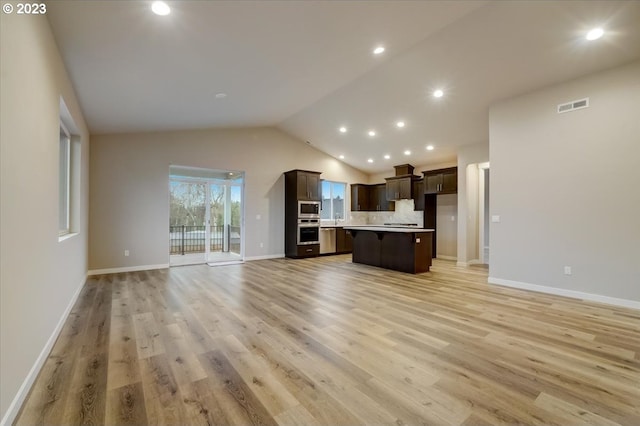1636 N Millican Crfeek St, Lafayette, OR 97127 - kitchen with open floor plan, stainless steel appliances, dark brown cabinets, lofted ceiling, and a kitchen island