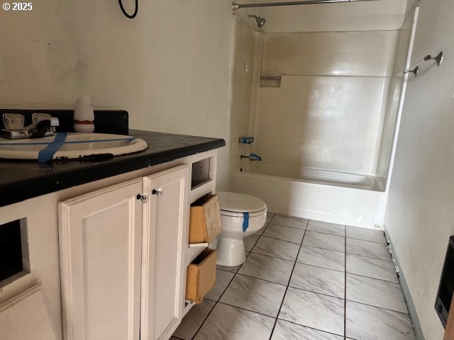 full bath with toilet, shower / tub combination, and vanity