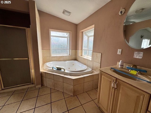 full bathroom featuring visible vents, vaulted ceiling, a shower stall, a whirlpool tub, and tile patterned floors