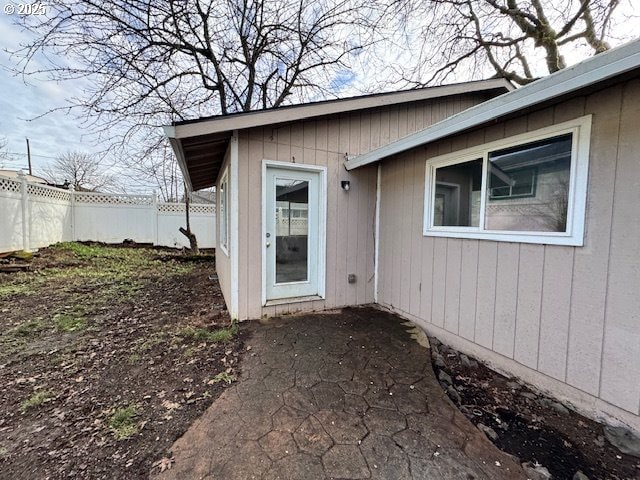 doorway to property with fence