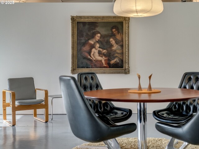 dining room featuring concrete flooring