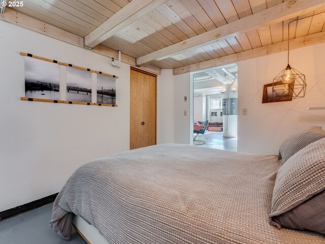 bedroom featuring beamed ceiling and wooden ceiling